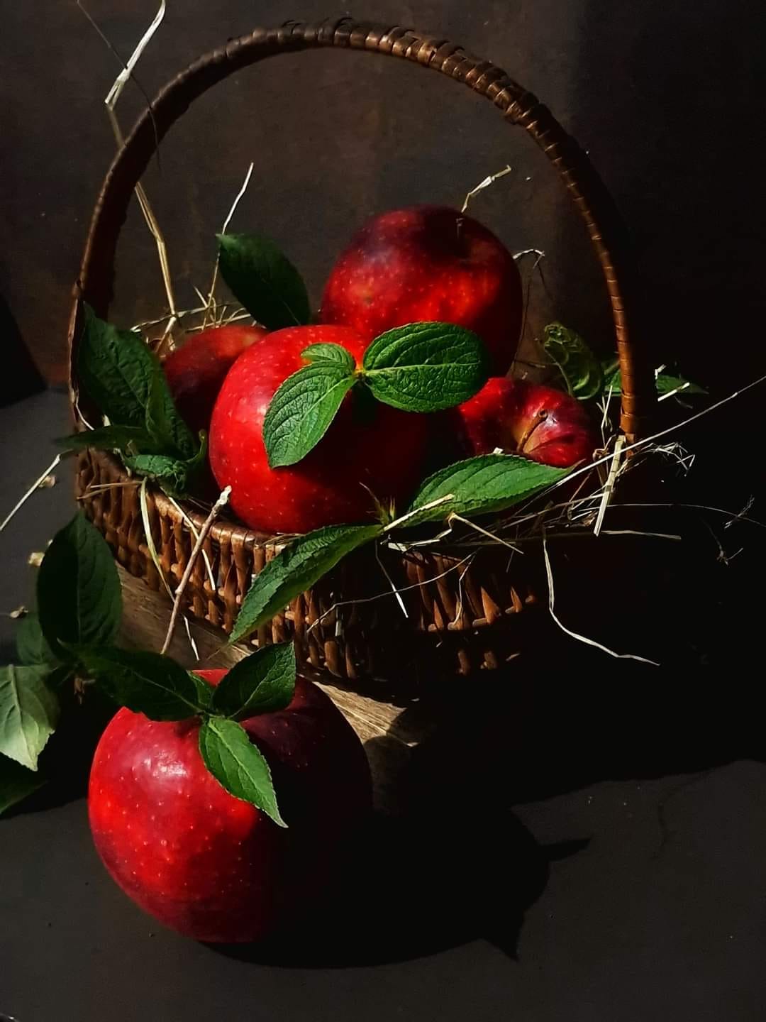 Straw basket with apples